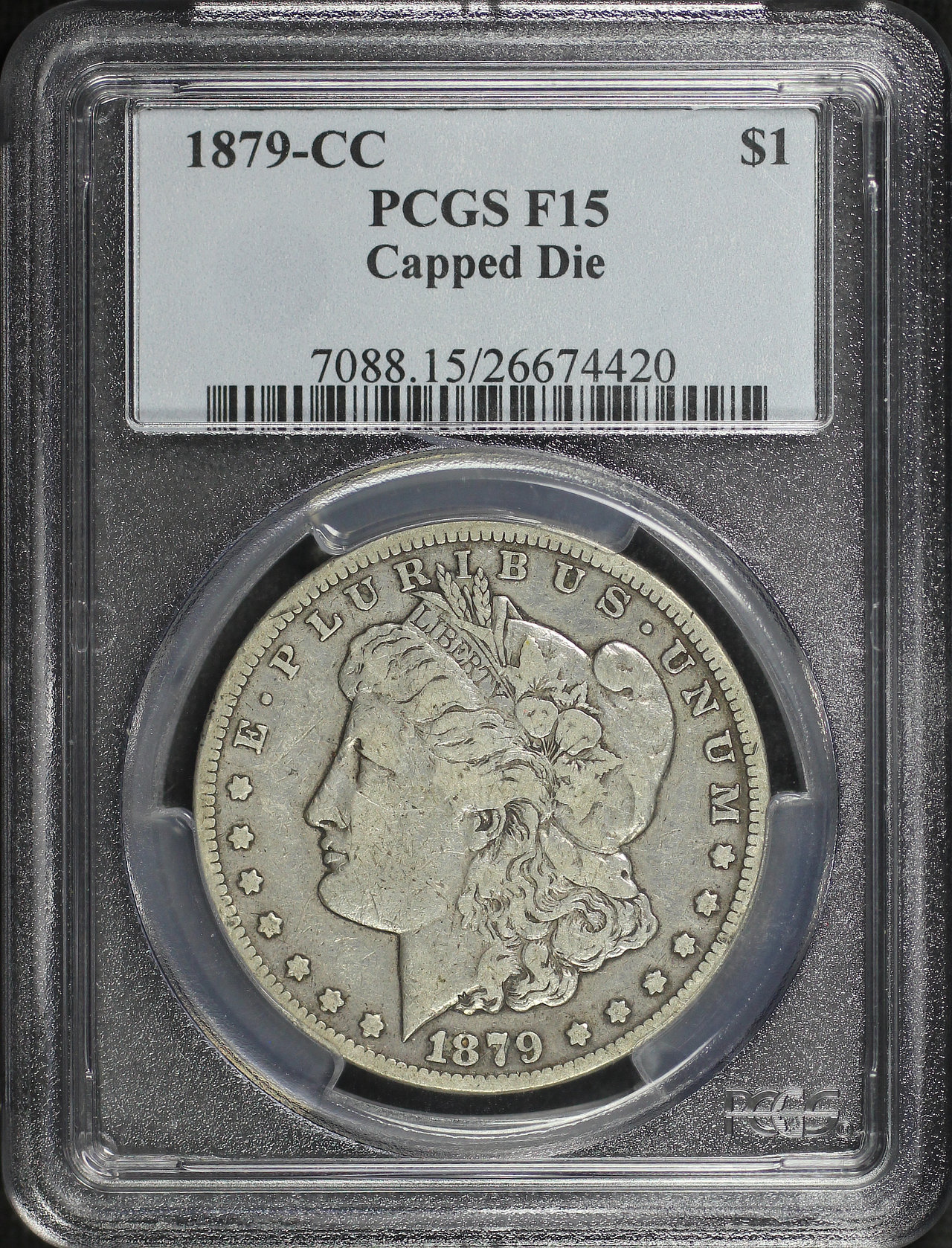 Obverse of this 1879-CC Morgan Dollar Capped Die PCGS F-15
