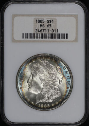Obverse of this 1885 Morgan Dollar NGC MS-65 Old Fatty Holder, Full Hologram – Blue & Sunset Hue Rim Toning