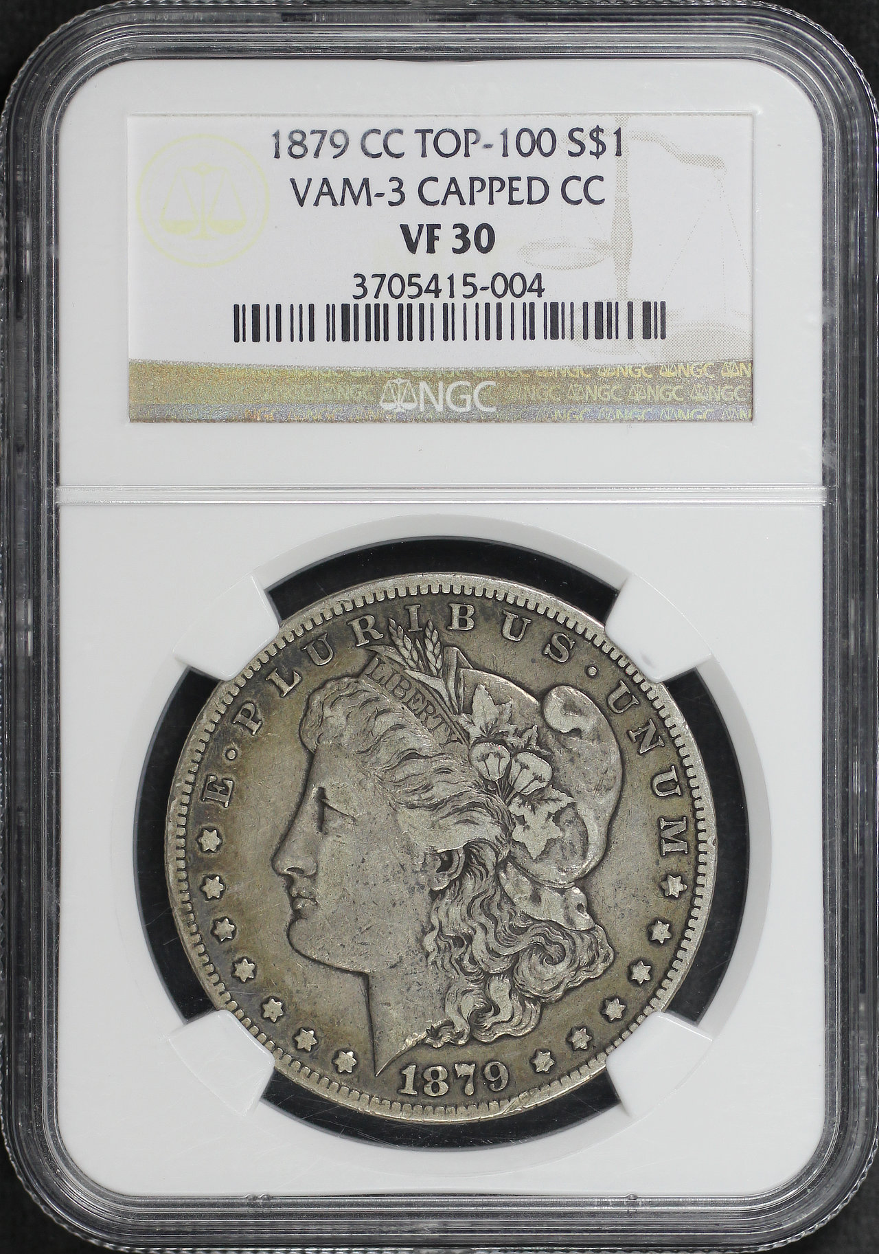 Obverse of this 1879-CC Morgan Dollar Capped Die VAM-3 Capped Die NGC VF-30