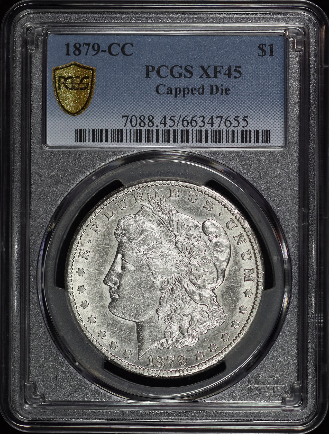 Obverse of this 1879-CC Morgan Dollar Capped Die PCGS XF-45