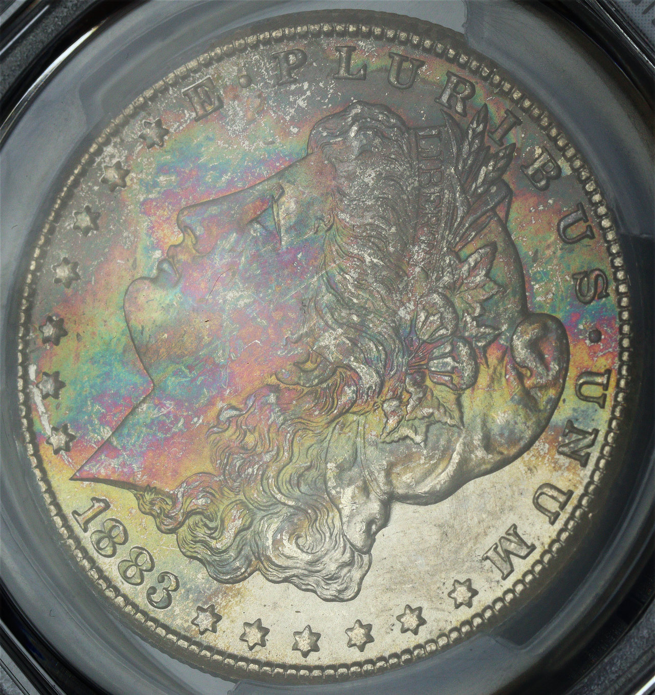 Gallery image of this 1883-CC Morgan Dollar PCGS MS-67 Velvety Rainbow Obverse Crescent Toning