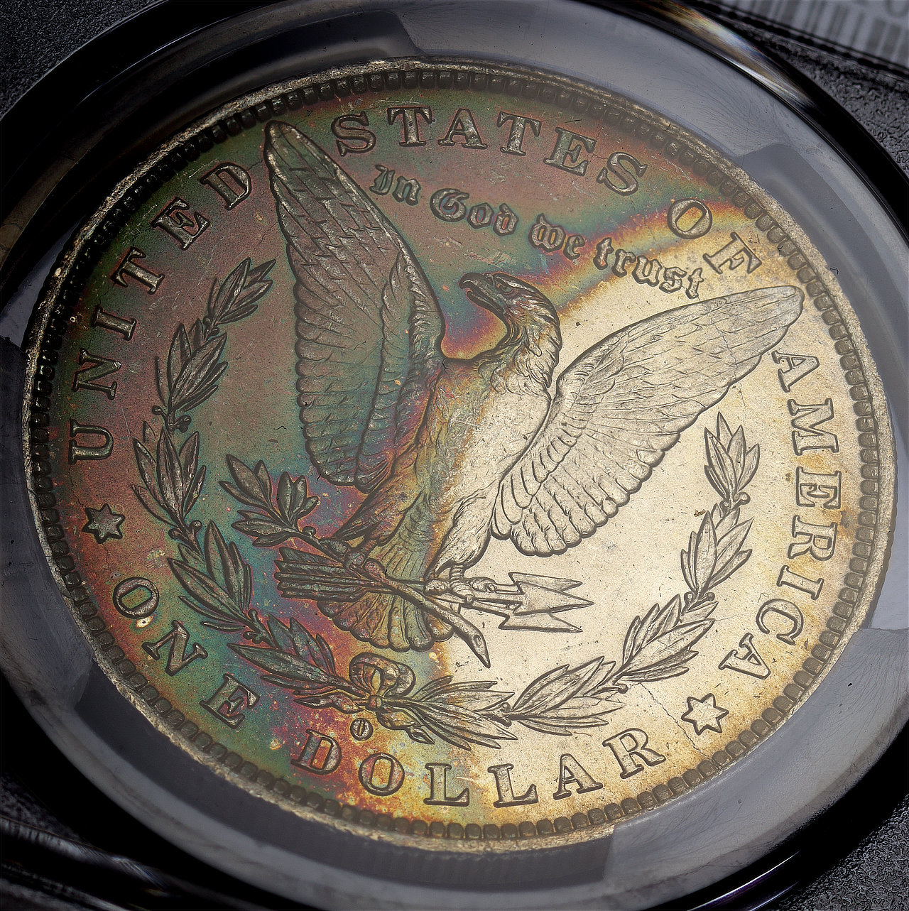 Gallery image of this 1884-O Morgan Dollar PCGS MS-65 Rainbow Reverse Crescent Toning