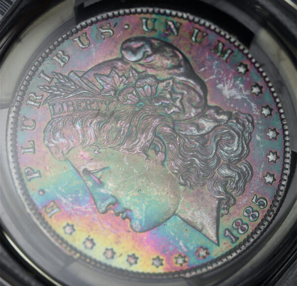 Gallery image of this 1885-O Morgan Dollar PCGS MS-64 CAC Vibrant Banded Rainbow Toning