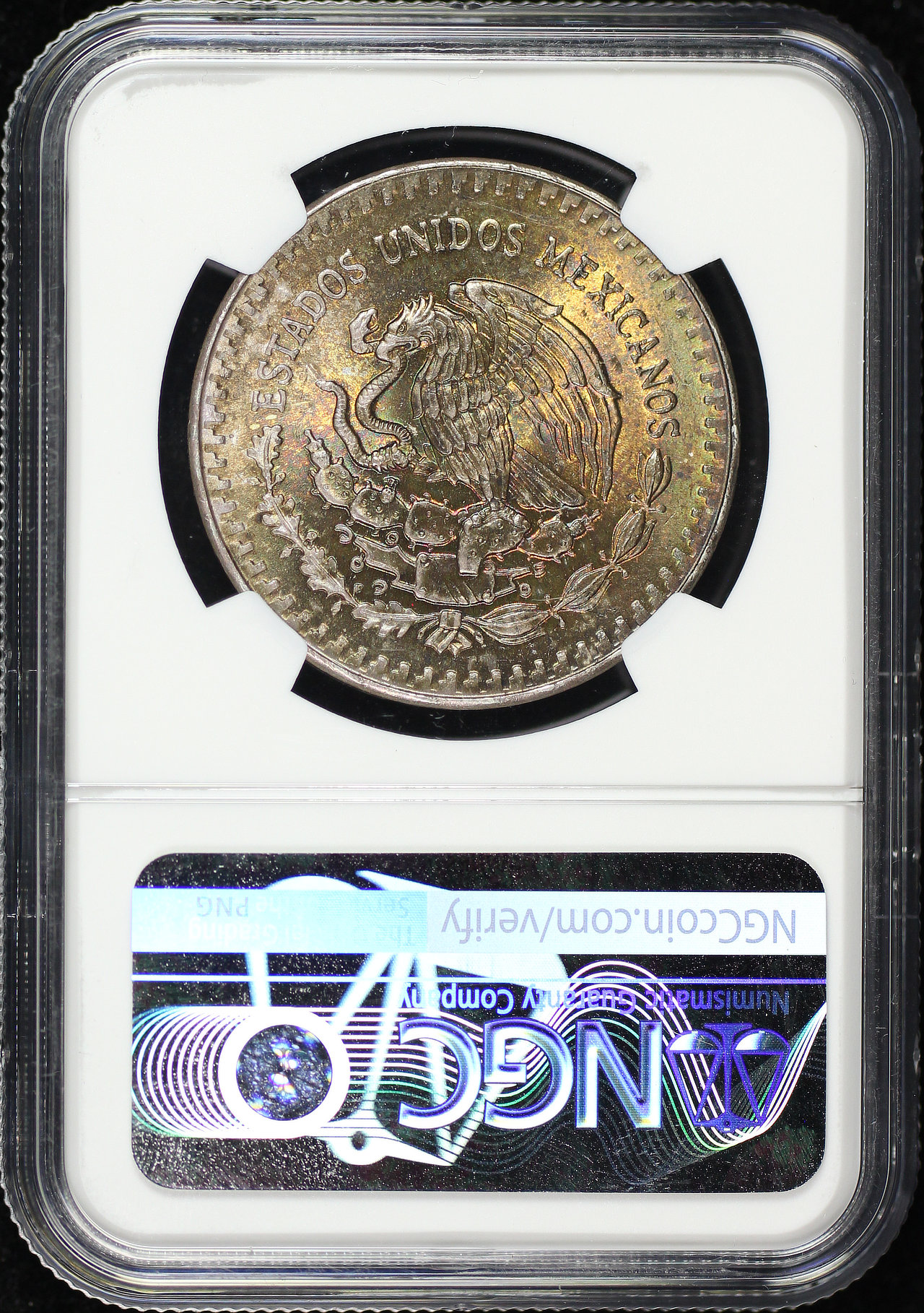 Reverse of this 1985-Mo Mexico Silver Libertad Onza NGC MS-64 Reverse Rainbow Toning