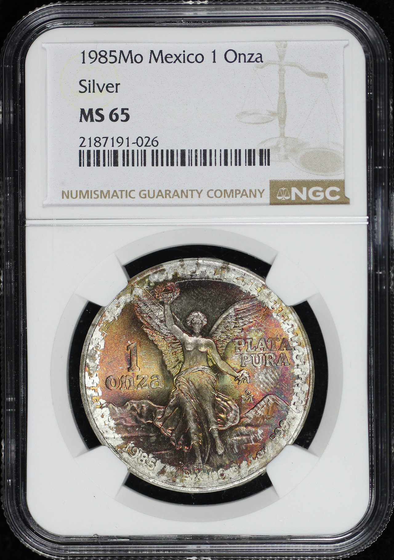 Obverse of this 1985-Mo Mexico Silver Libertad Onza NGC MS-65 End Roll Obverse Rainbow Toning
