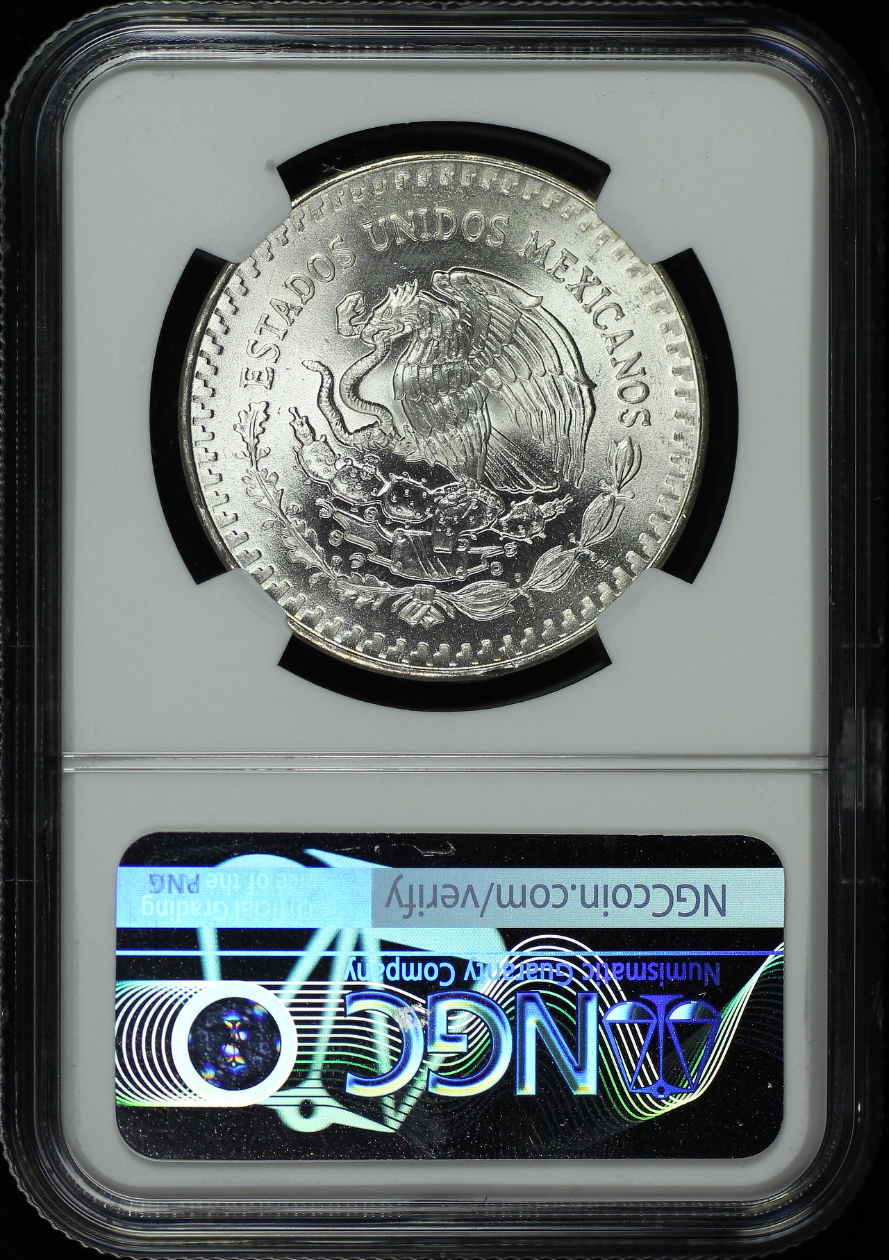 Reverse of this 1985-Mo Mexico Silver Libertad Onza NGC MS-65 End Roll Obverse Rainbow Toning