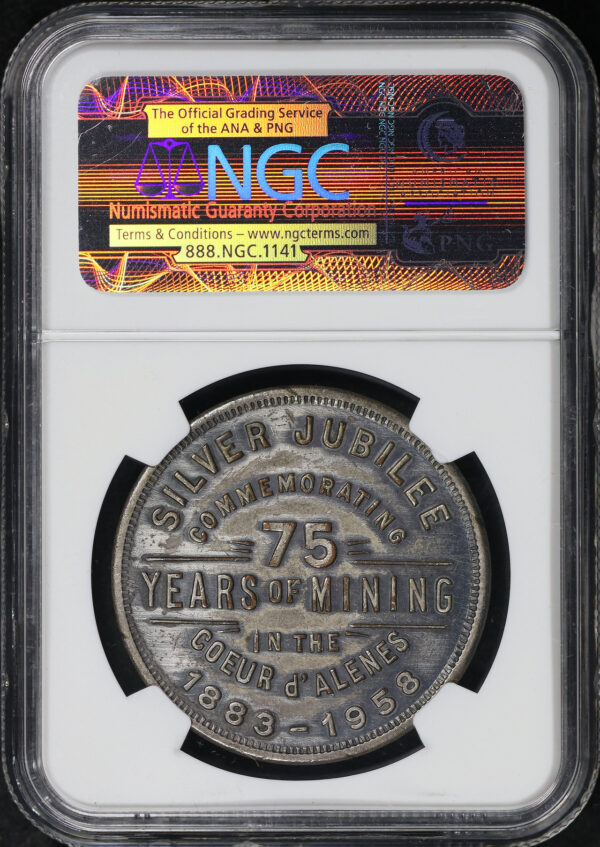 Reverse of this 1958 ID HK-515 Coeur D’Alenes Silver Jub So-Called Dollar NGC MS-62